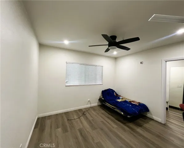 a living room with a bed furniture and a window