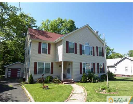 98 East Cliff Road Colonia, NJ 07067 - Photo 22 of 23 a front view of a house with garden