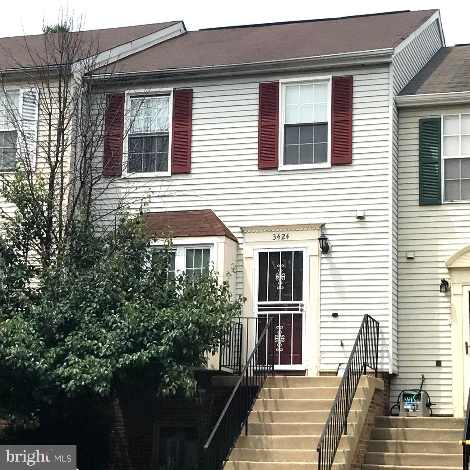 a view of a house with more windows and brick wall