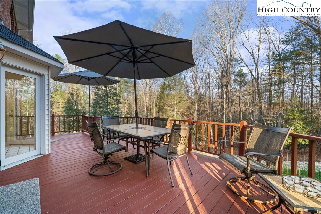 458 Jim Caudill Road Wilkesboro, NC 28697 - Photo 15 of 50 a view of balcony with furniture and wooden floor