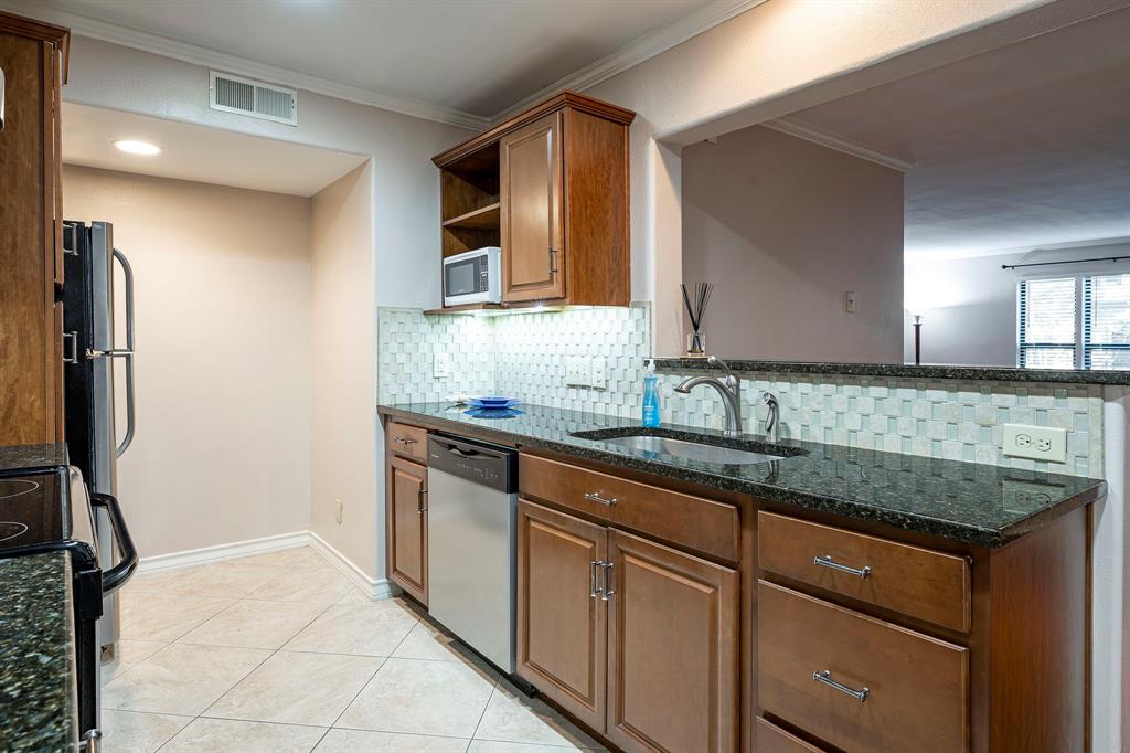10757 Villager Road, Unit B Dallas, TX 75230 - Photo 2 of 36 Beautiful large open kitchen design with plenty of counter space.