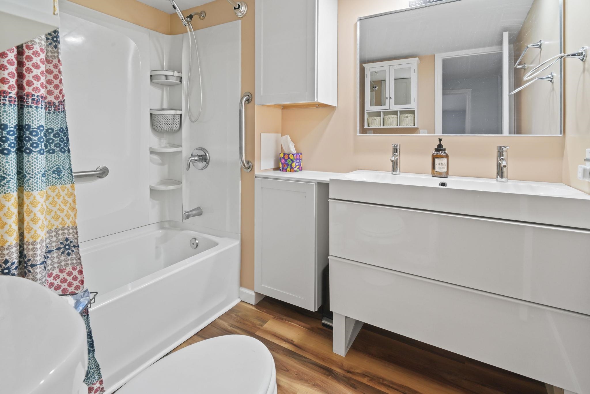 45 Shamrock Circle Murrells Inlet, SC 29576 - Photo 27 of 32 Bathroom featuring vanity, shower / tub combo, and dark wood-style flooring