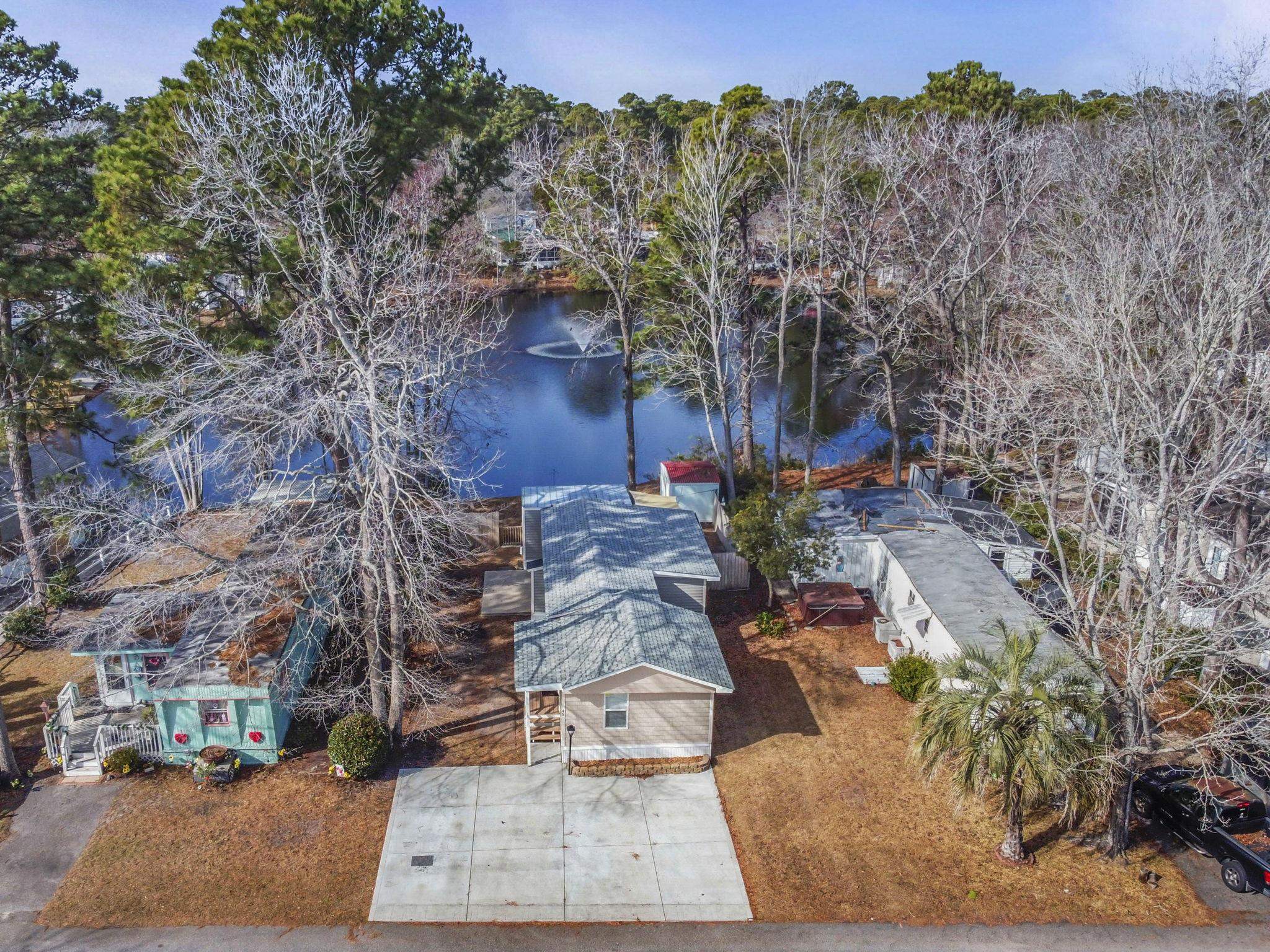 45 Shamrock Circle Murrells Inlet, SC 29576 - Photo 4 of 32 Bird's eye view of a nearby body of water and a tree filled landscape