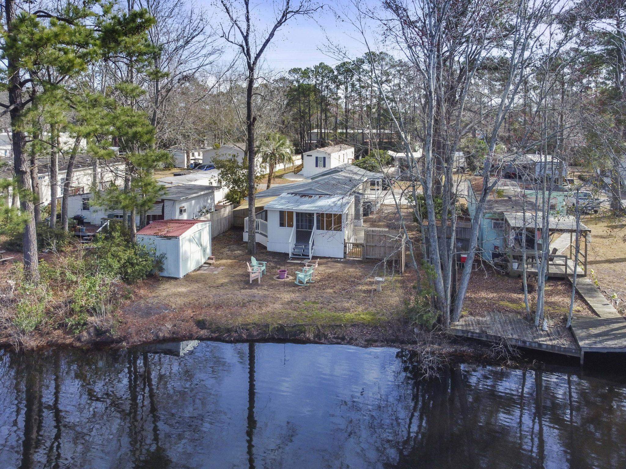 45 Shamrock Circle Murrells Inlet, SC 29576 - Photo 5 of 32 Bird's eye view of a nearby body of water and a tree filled landscape