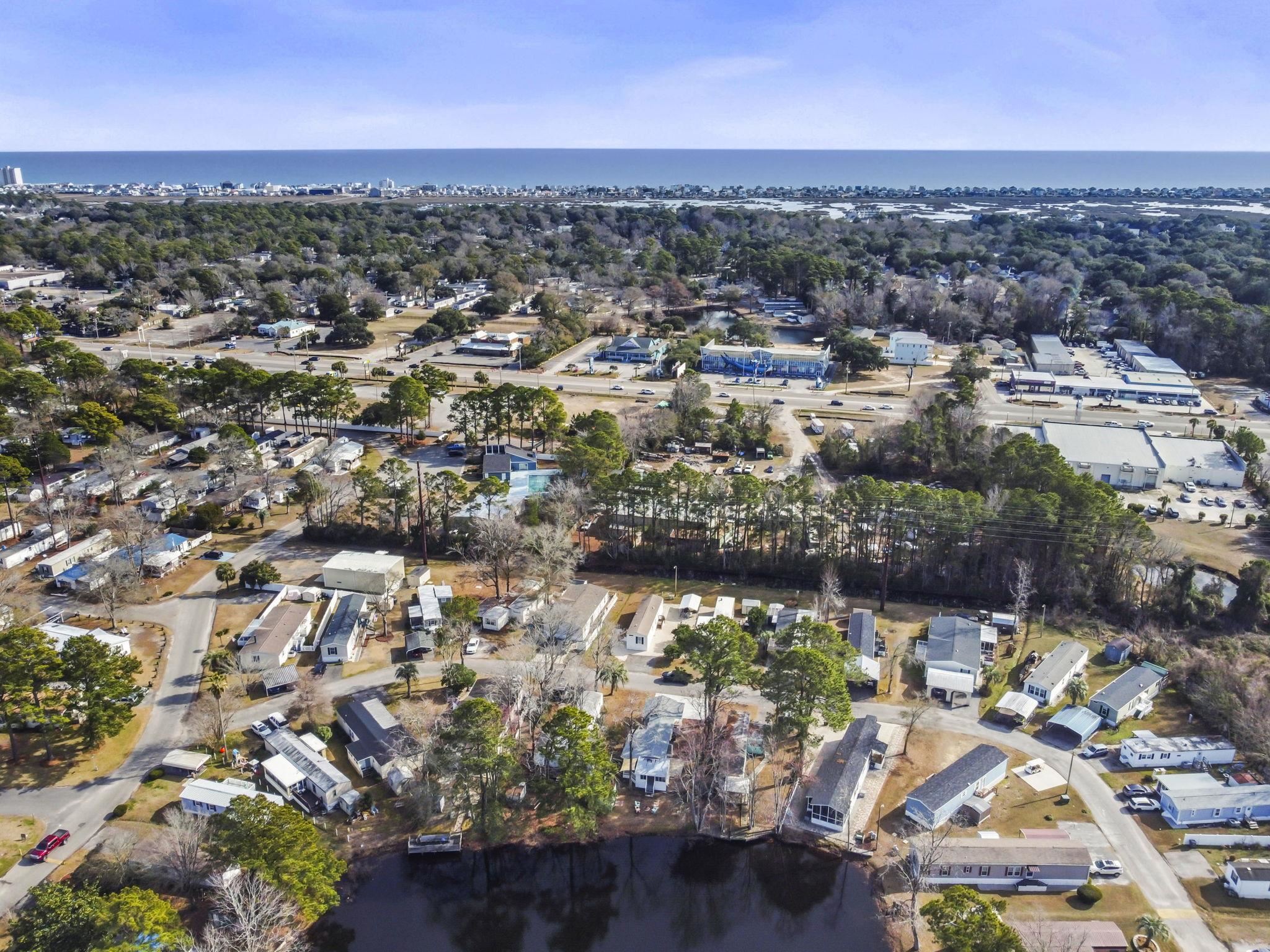 45 Shamrock Circle Murrells Inlet, SC 29576 - Photo 7 of 32 Aerial overview of property's location with a nearby body of water and nearby suburban area