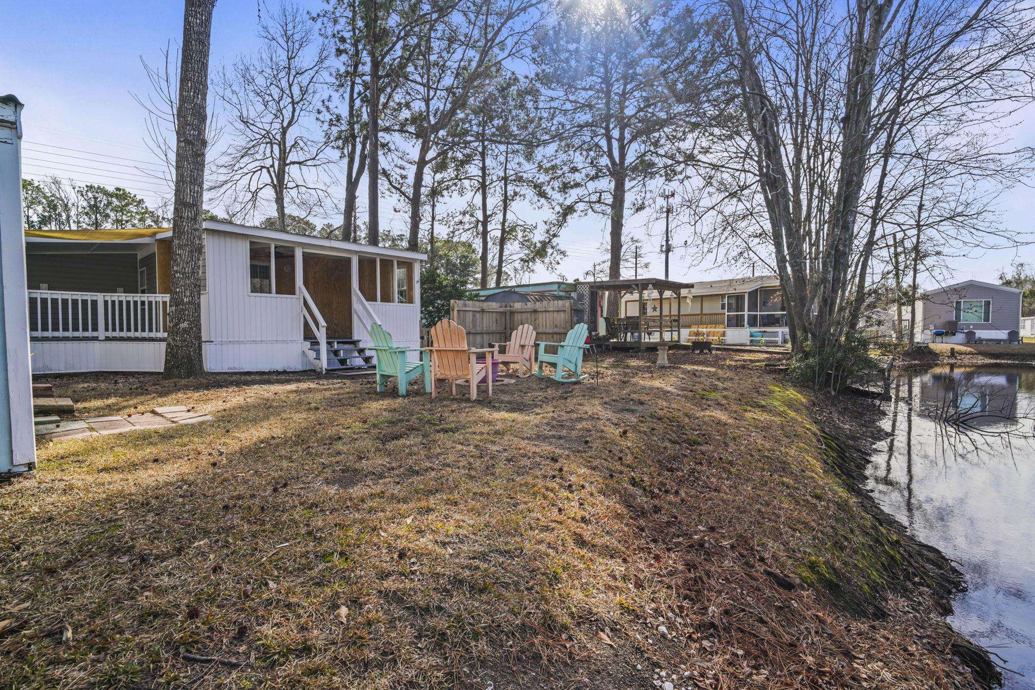 45 Shamrock Circle Murrells Inlet, SC 29576 - Photo 9 of 32 View of yard with a sunroom