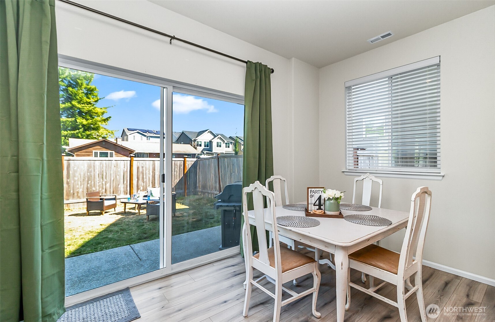 907 Bryant Road Sultan, WA 98294 - Photo 14 of 40 a view of a dining room with furniture wooden floor and a floor to ceiling window