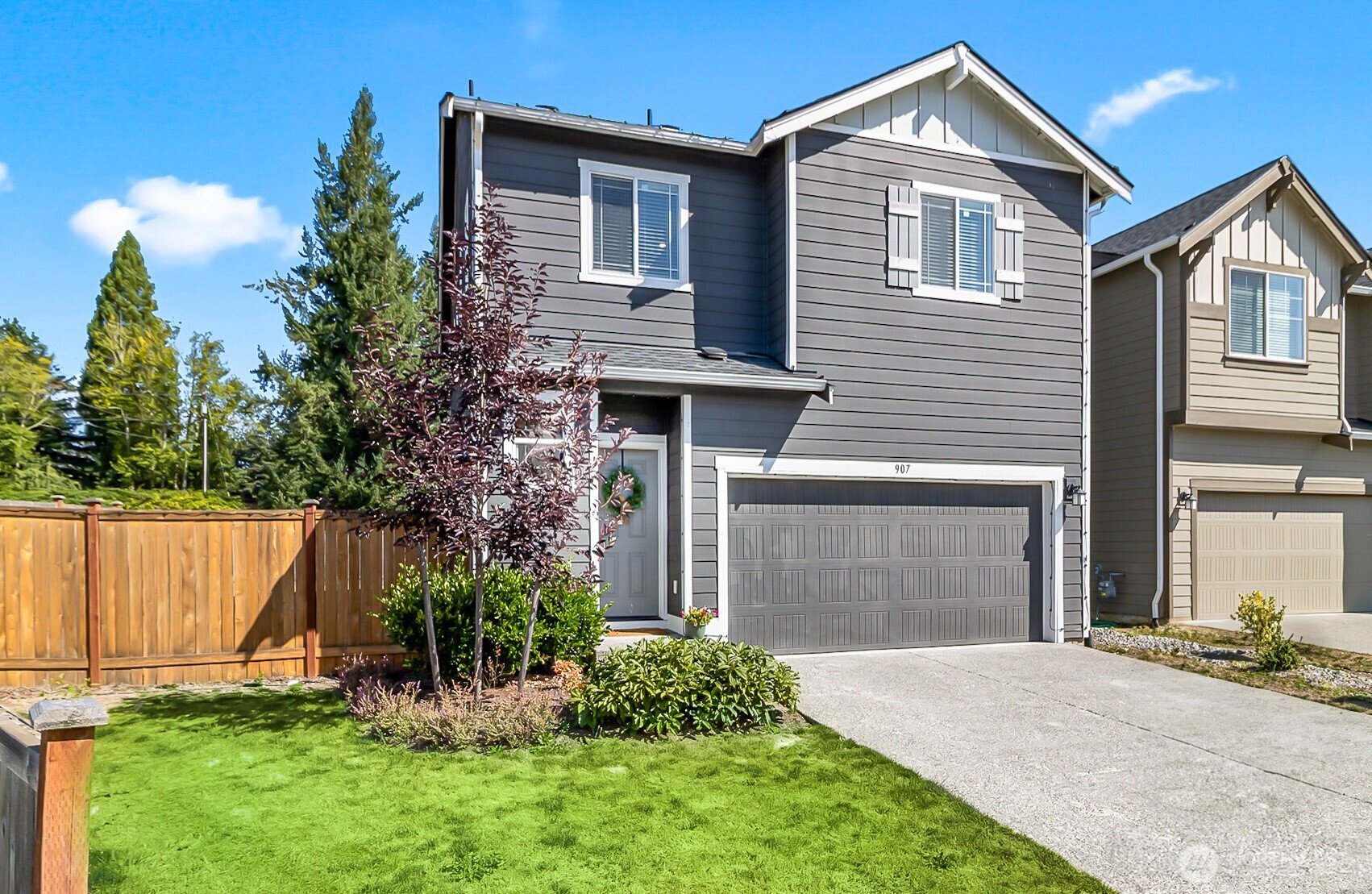 907 Bryant Road Sultan, WA 98294 - Photo 2 of 40 a front view of a house with a yard and garage