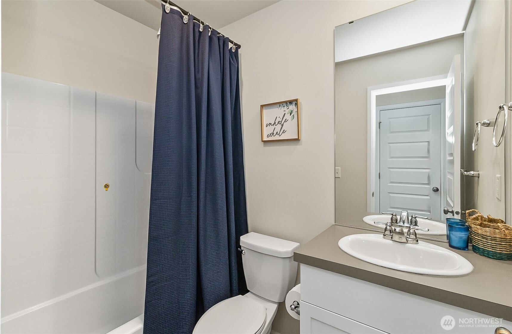 907 Bryant Road Sultan, WA 98294 - Photo 22 of 40 a bathroom with a toilet a sink and a mirror