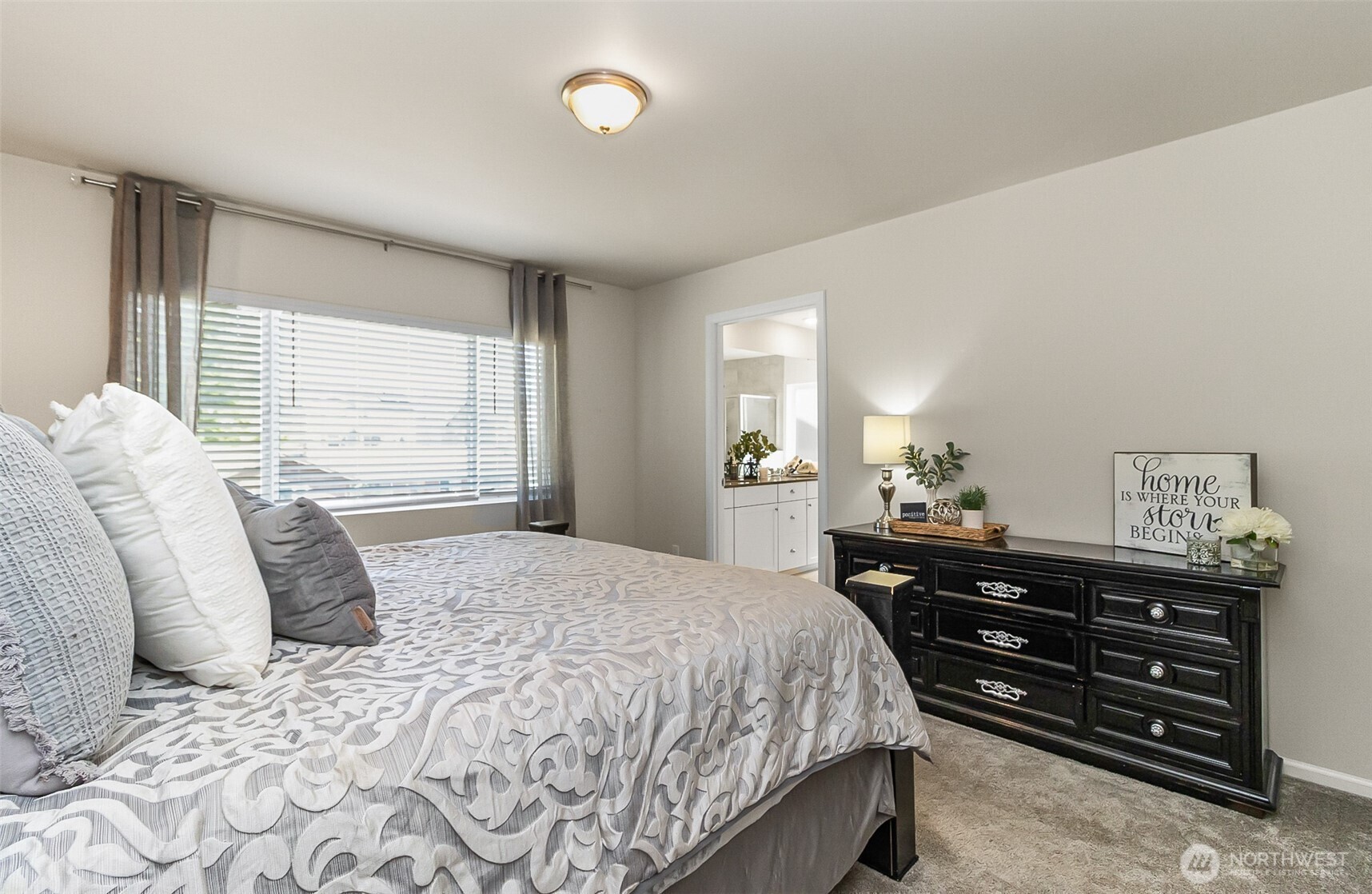 907 Bryant Road Sultan, WA 98294 - Photo 24 of 40 a bedroom with a bed and dresser with window