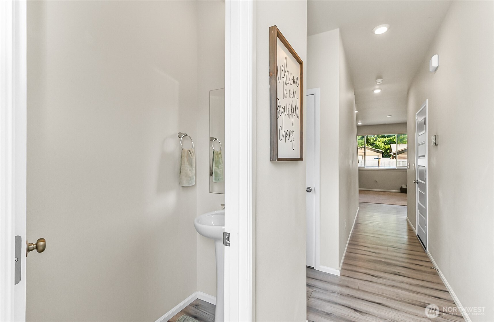 907 Bryant Road Sultan, WA 98294 - Photo 3 of 40 a view of a hallway with wooden floor and staircase