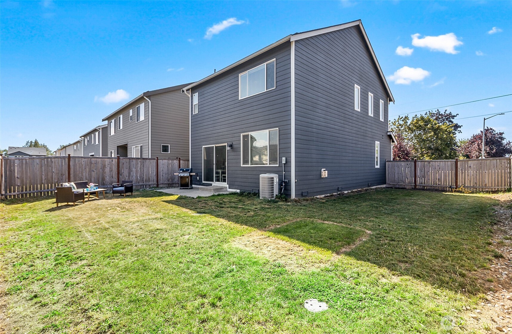 907 Bryant Road Sultan, WA 98294 - Photo 31 of 40 a swimming pool with yard and outdoor seating