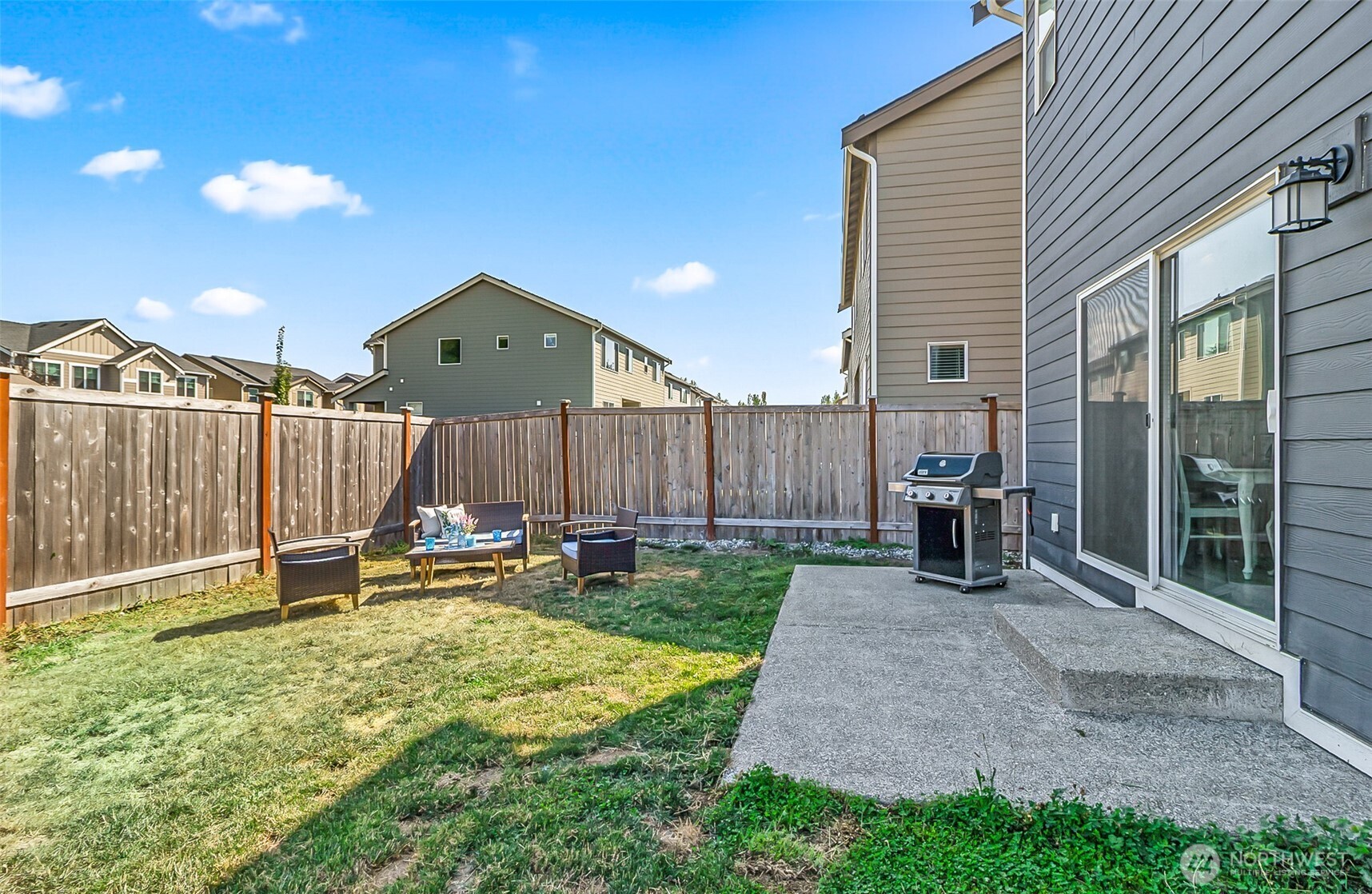 907 Bryant Road Sultan, WA 98294 - Photo 32 of 40 a backyard of a house with table and chairs