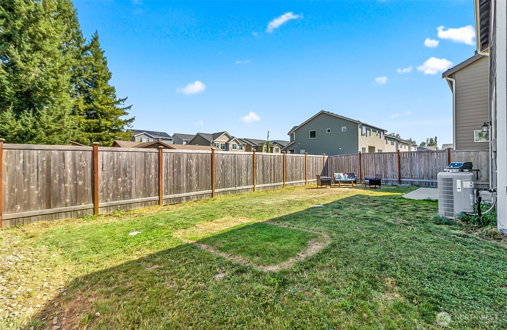 907 Bryant Road Sultan, WA 98294 - Photo 33 of 40 a view of a house with a yard and a large tree