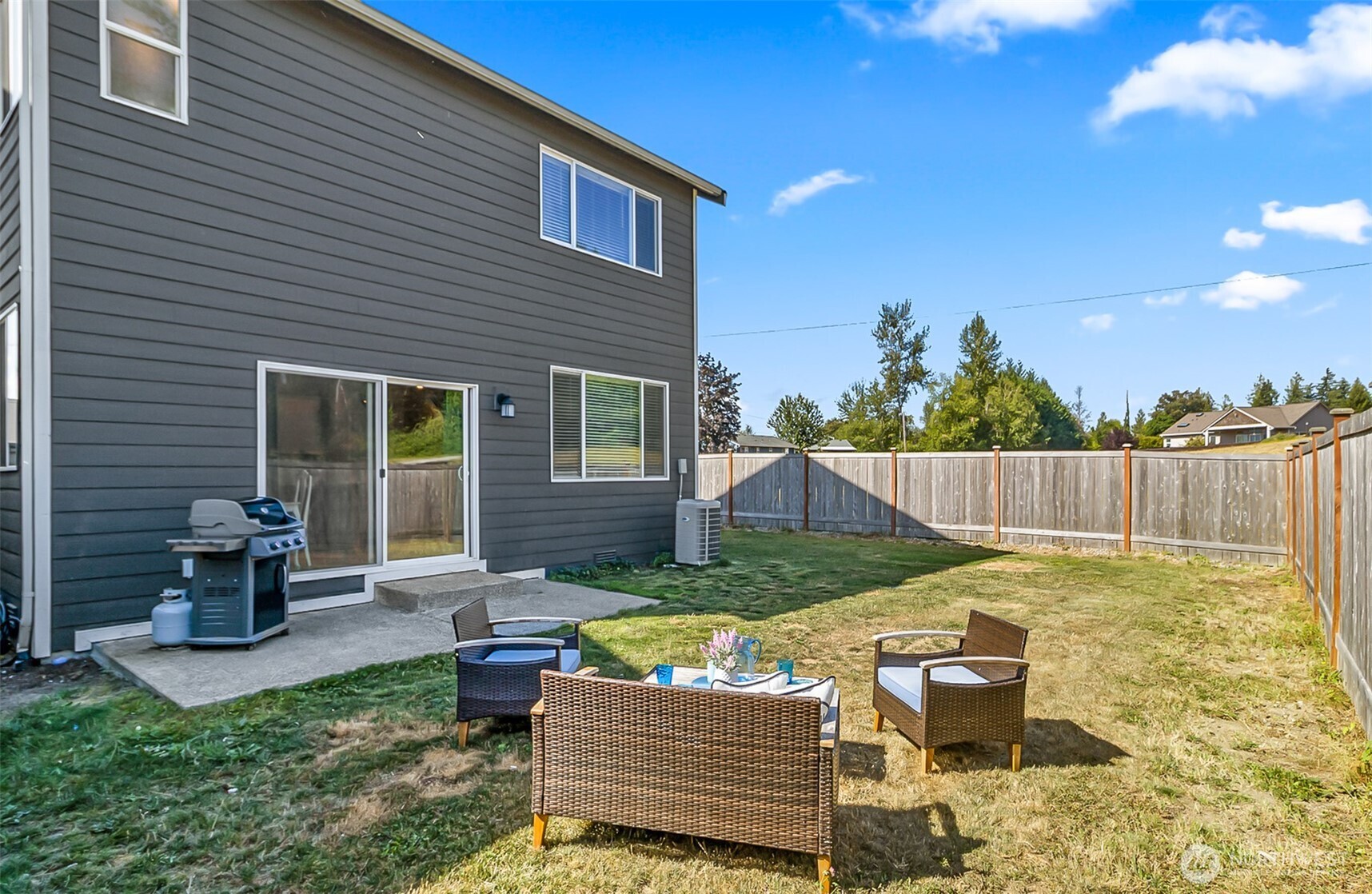 907 Bryant Road Sultan, WA 98294 - Photo 35 of 40 a view of backyard of house with seating space