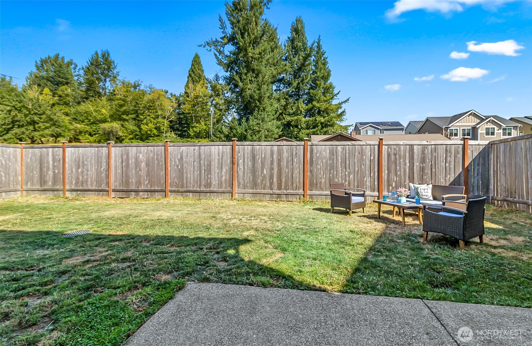 907 Bryant Road Sultan, WA 98294 - Photo 36 of 40 a view of swimming pool with lawn chairs and wooden fence