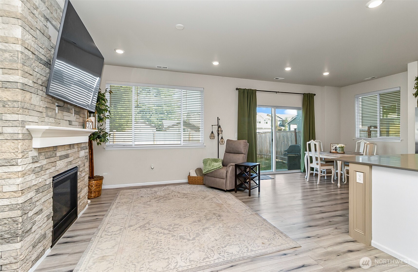907 Bryant Road Sultan, WA 98294 - Photo 5 of 40 a living room with furniture a fireplace and a table