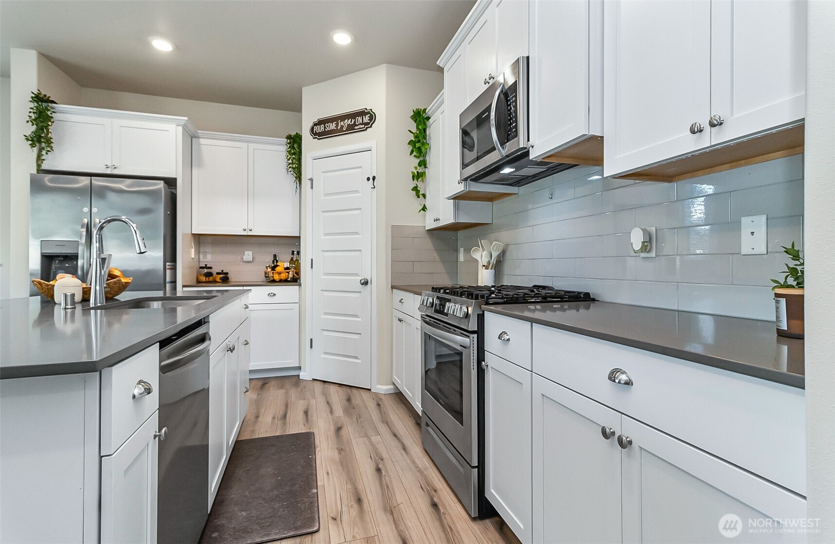 907 Bryant Road Sultan, WA 98294 - Photo 9 of 40 a kitchen with stainless steel appliances granite countertop a sink a stove and a refrigerator