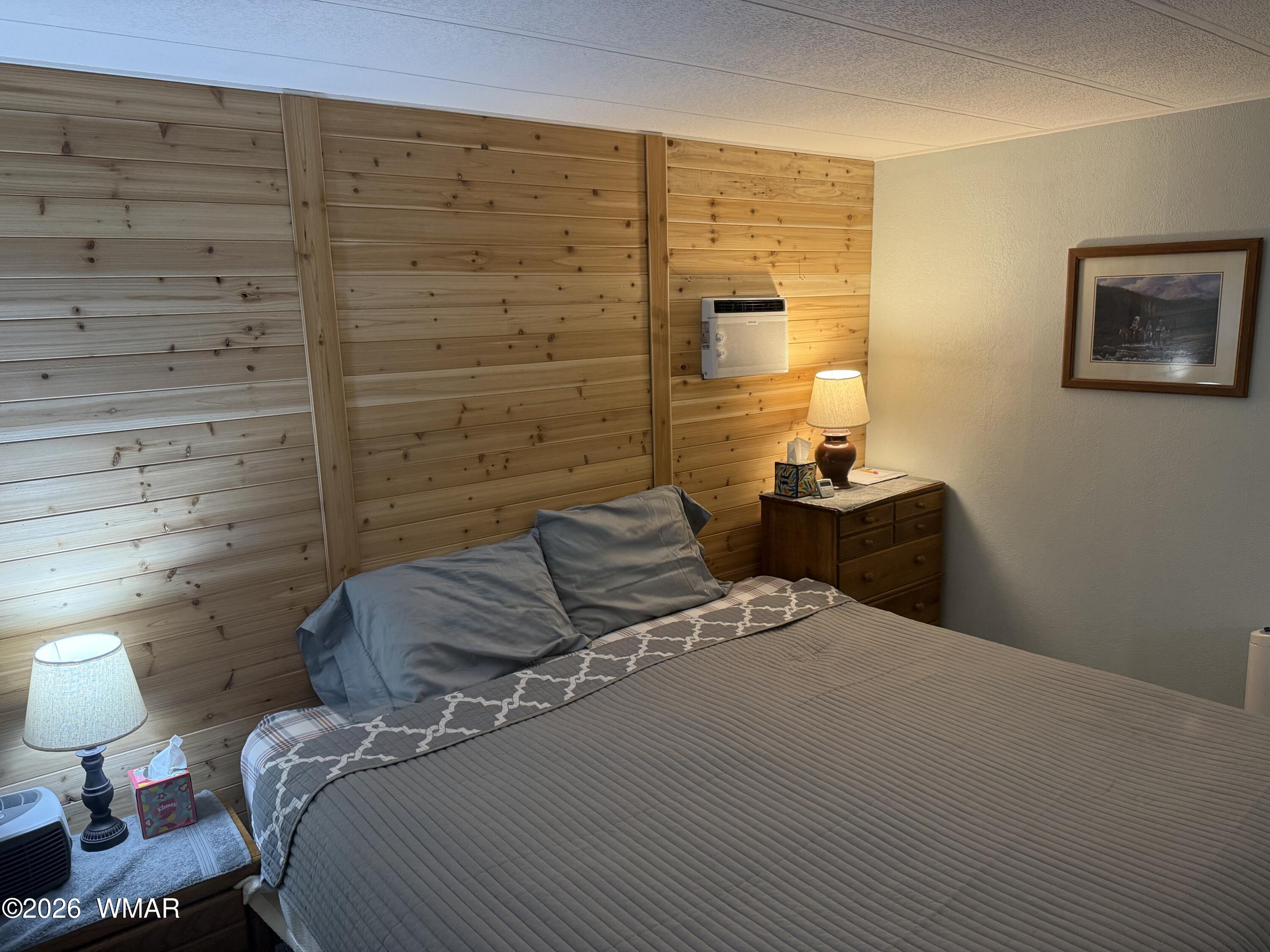 727 South Butler Street Eagar, AZ 85925 - Photo 14 of 32 a bedroom with a bed and a lamp on table
