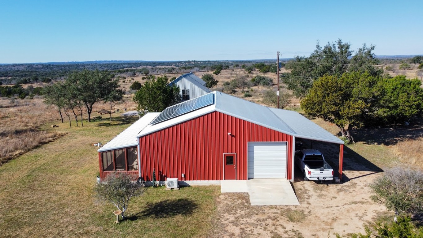 997 Big Sandy Road Johnson City, TX 78636 - Photo 11 of 33 a view of a house with backyard and trees