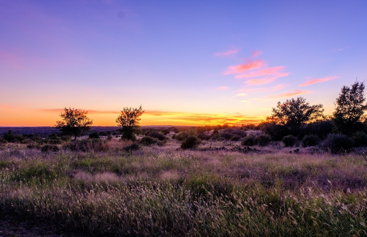 997 Big Sandy Road Johnson City, TX 78636 - Photo 21 of 33 a view of a lush green field