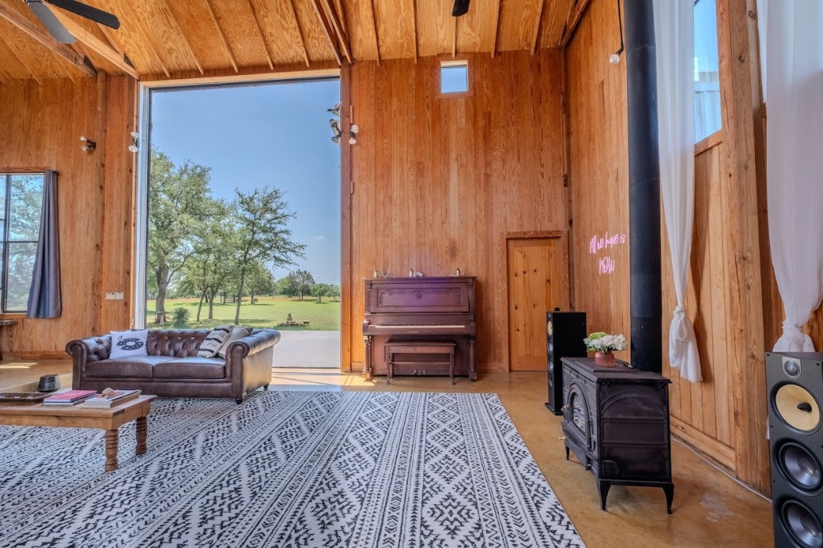997 Big Sandy Road Johnson City, TX 78636 - Photo 5 of 33 a backyard of a house with barbeque oven table and chairs