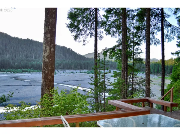 a view of house with yard and sitting area