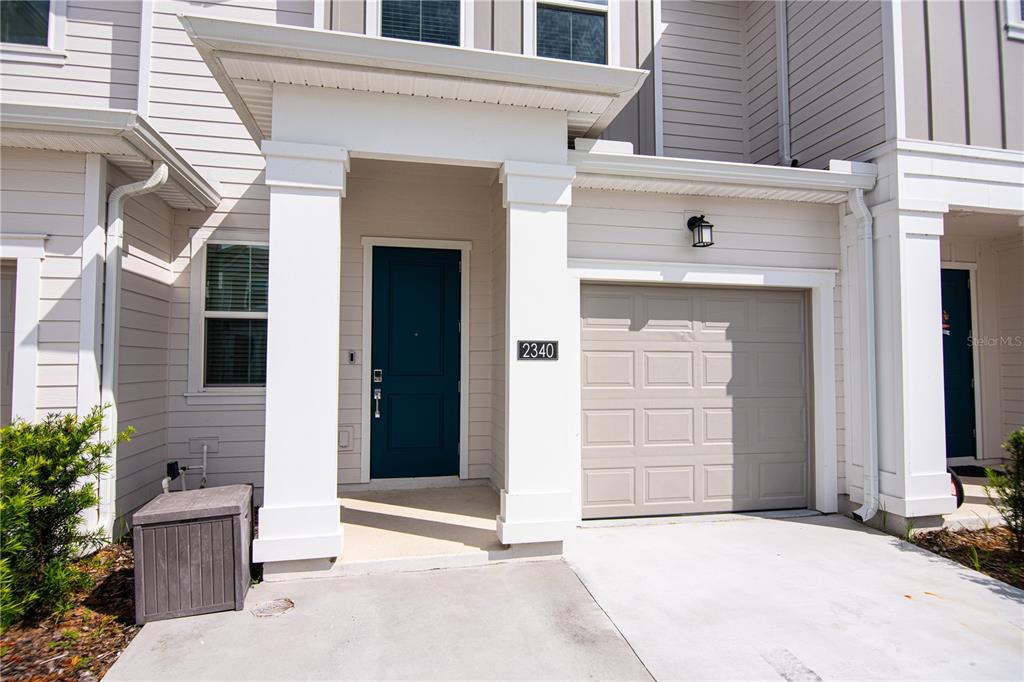 2340 Brook Marsh Loop Kissimmee, FL 34747 - Photo 16 of 53 a view of a house with a wooden door