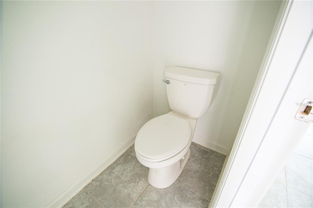 2340 Brook Marsh Loop Kissimmee, FL 34747 - Photo 23 of 53 a white toilet sitting next to a white cabinet