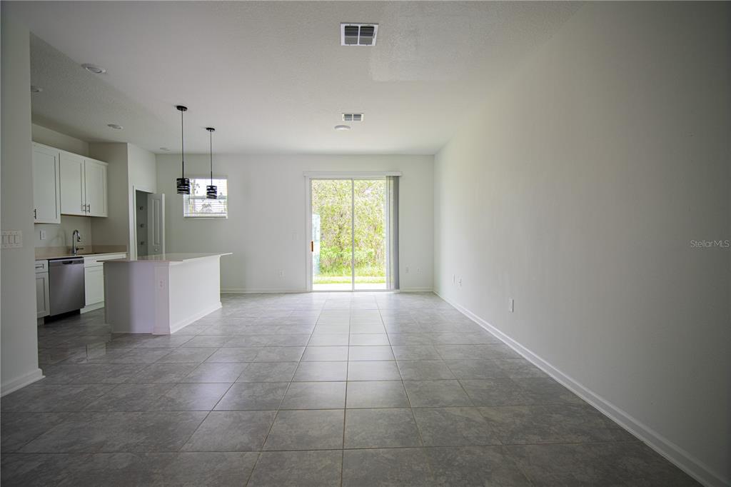 2340 Brook Marsh Loop Kissimmee, FL 34747 - Photo 25 of 53 a view of a kitchen with a sink and a window