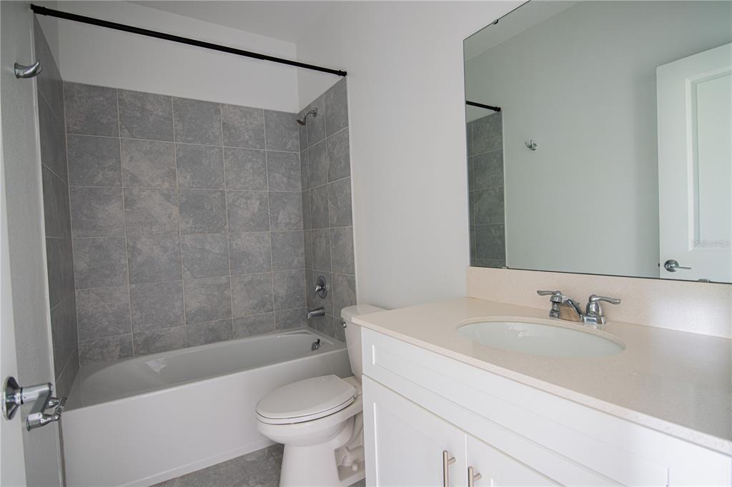 2340 Brook Marsh Loop Kissimmee, FL 34747 - Photo 35 of 53 a bathroom with a sink a toilet and a bathtub