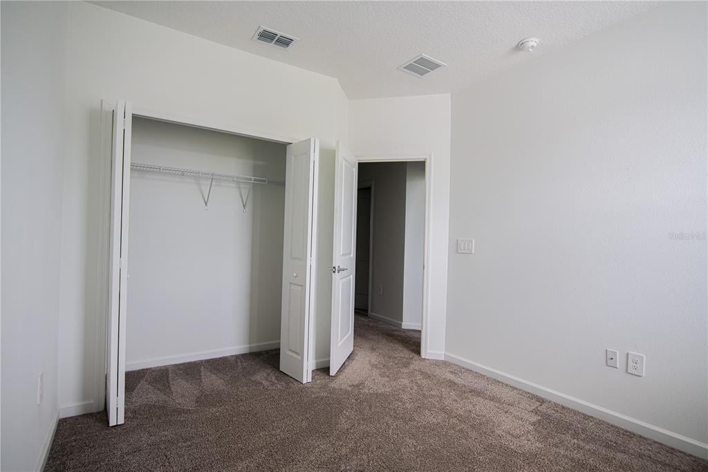 2340 Brook Marsh Loop Kissimmee, FL 34747 - Photo 40 of 53 a view of an empty room with closet and a bathroom