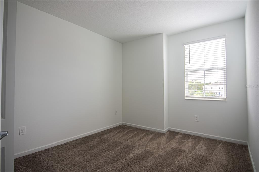 2340 Brook Marsh Loop Kissimmee, FL 34747 - Photo 41 of 53 an empty room with a window