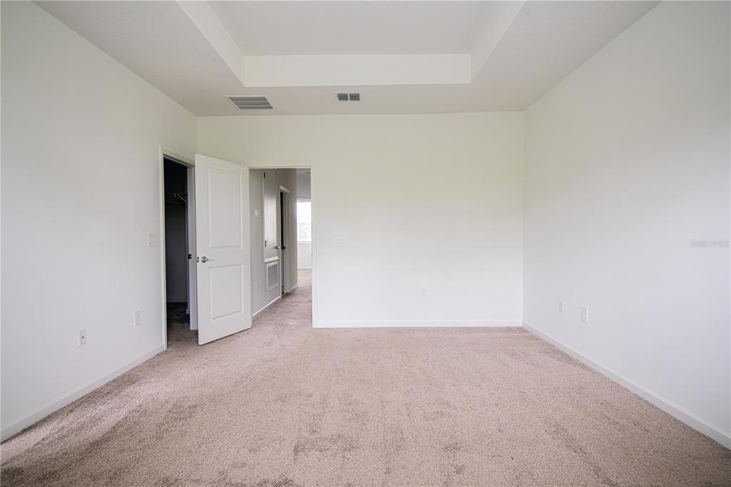 2340 Brook Marsh Loop Kissimmee, FL 34747 - Photo 48 of 53 an empty room with an entryway