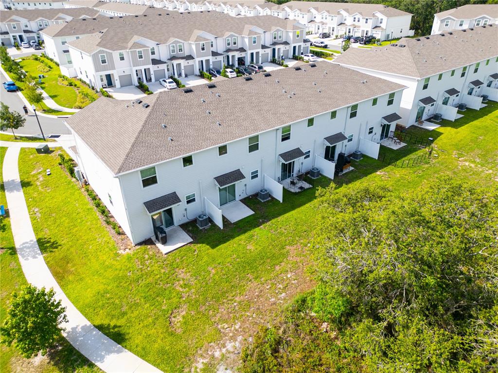 2340 Brook Marsh Loop Kissimmee, FL 34747 - Photo 6 of 53 an aerial view of residential houses with swimming pool
