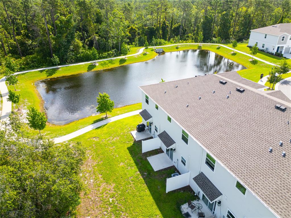 2340 Brook Marsh Loop Kissimmee, FL 34747 - Photo 8 of 53 a view of an swimming pool with a yard