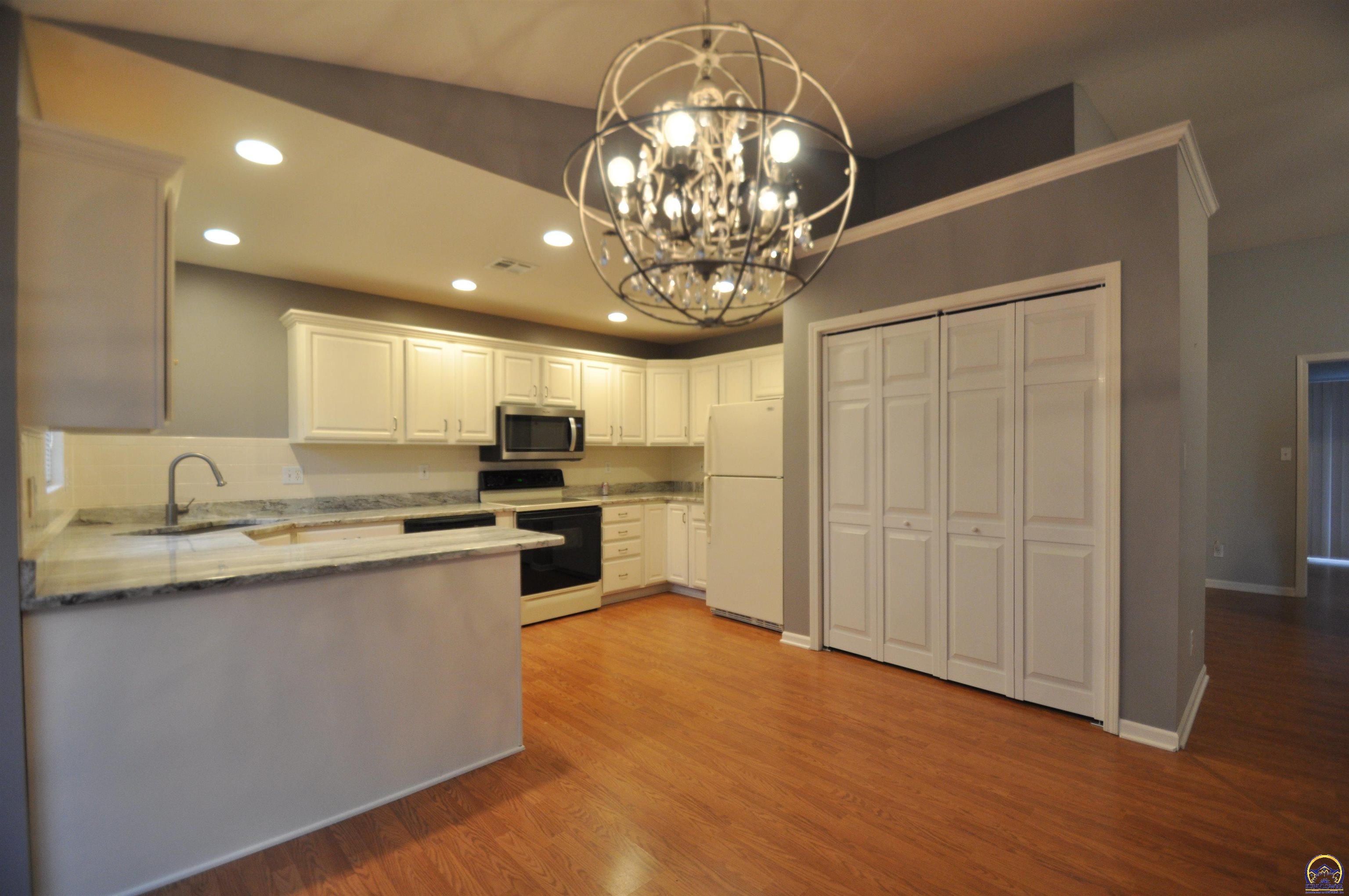 5822 Southwest Sterling Lane Topeka, KS 66604 - Photo 13 of 51 dining area into kitchen