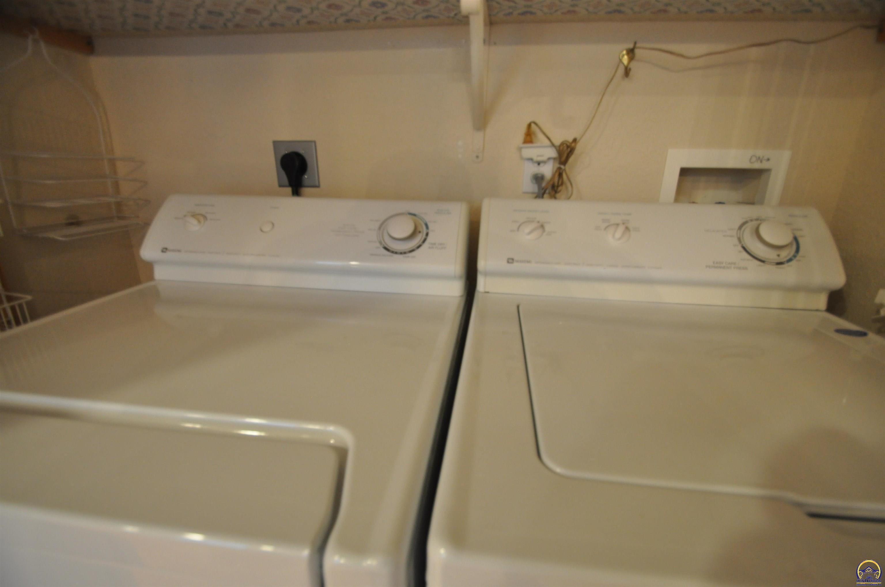 5822 Southwest Sterling Lane Topeka, KS 66604 - Photo 21 of 51 utility closet in kitchen