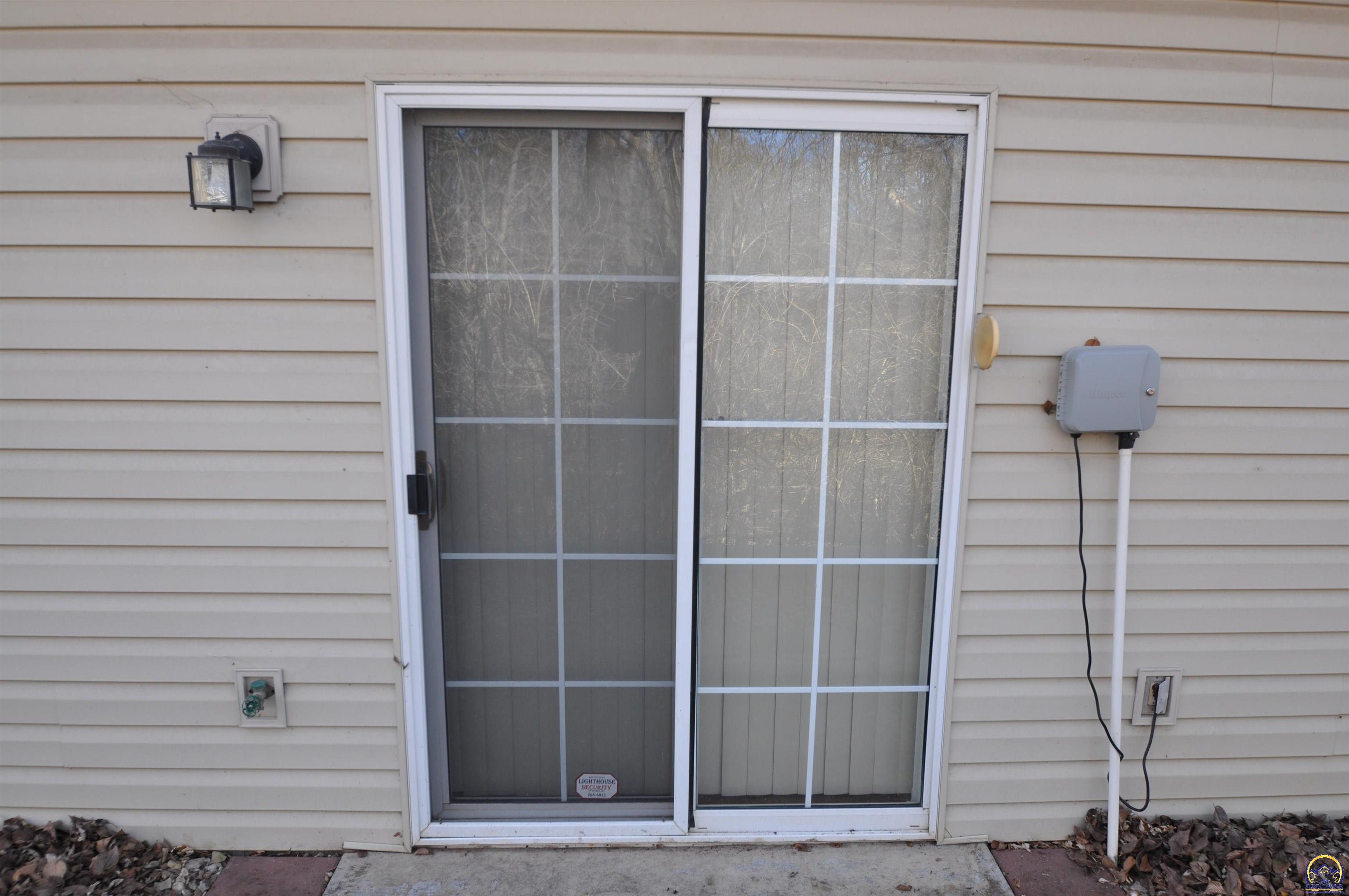5822 Southwest Sterling Lane Topeka, KS 66604 - Photo 42 of 51 rear view door from sunroom