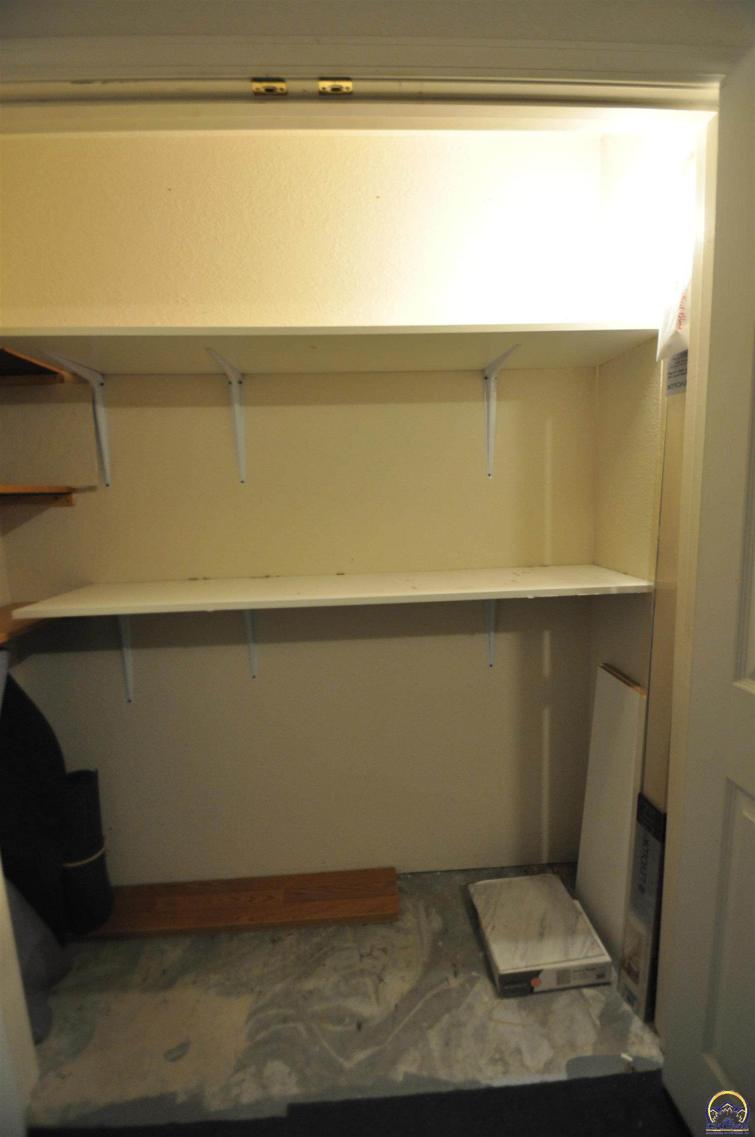 5822 Southwest Sterling Lane Topeka, KS 66604 - Photo 49 of 51 garage storage shelf