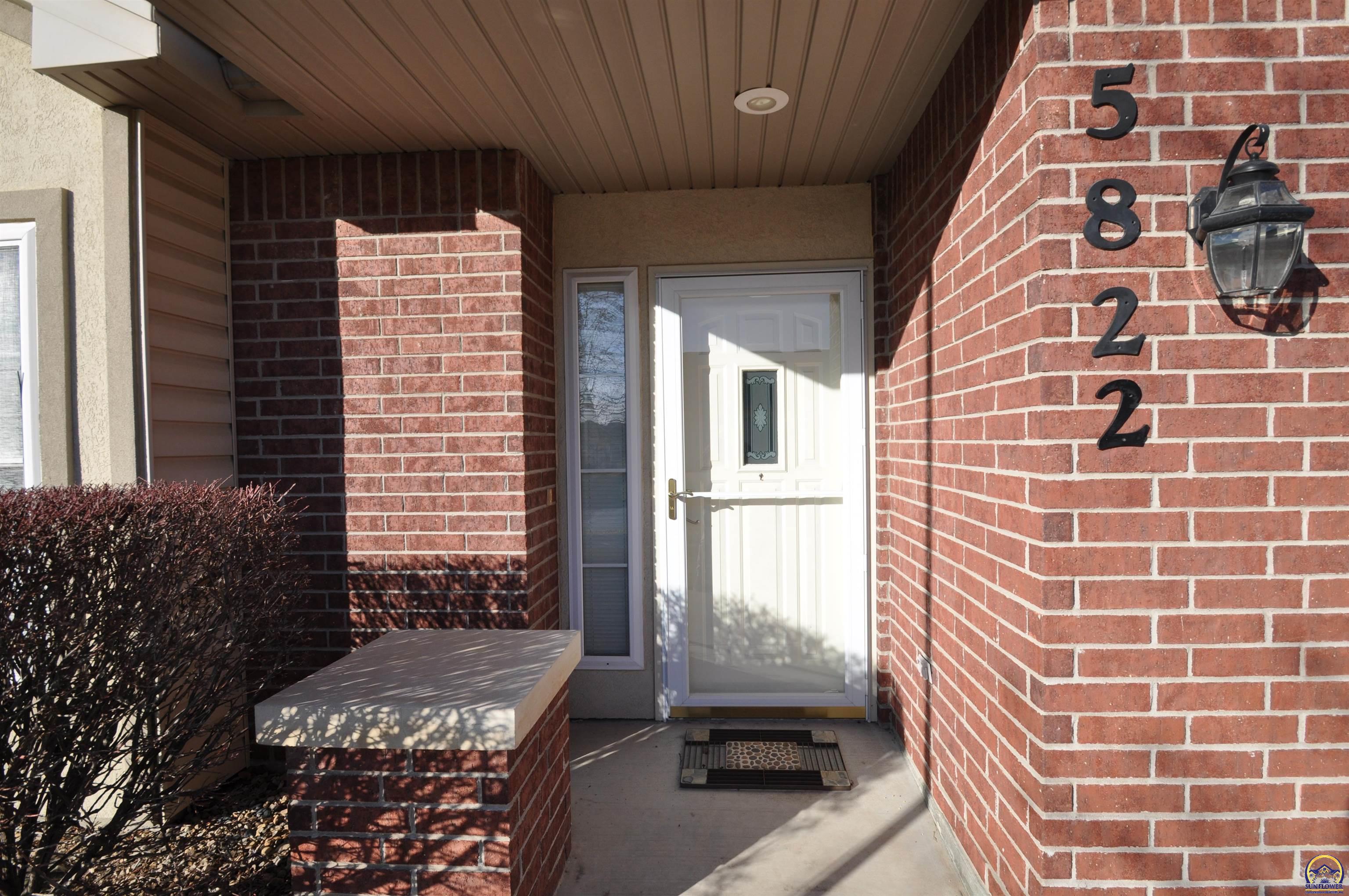 5822 Southwest Sterling Lane Topeka, KS 66604 - Photo 5 of 51 front covered entry