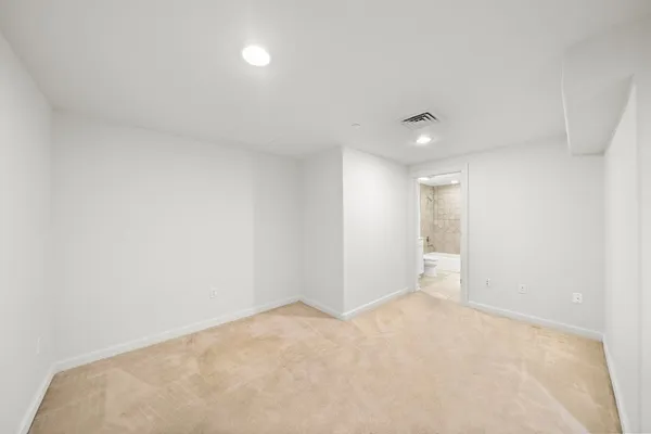 a spacious bathroom with a bathtub and a sink