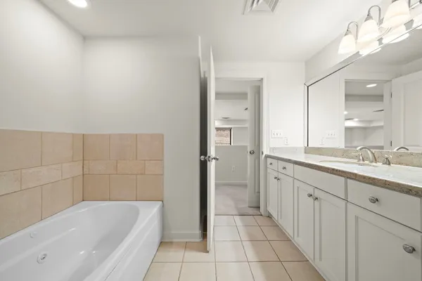 a bathroom with a bathtub and shower