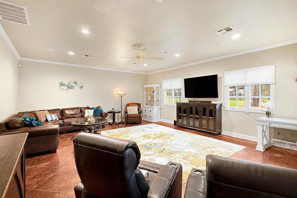 103 Glenn Road Mabank, TX 75156 - Photo 21 of 38 a living room with fireplace furniture and a flat screen tv