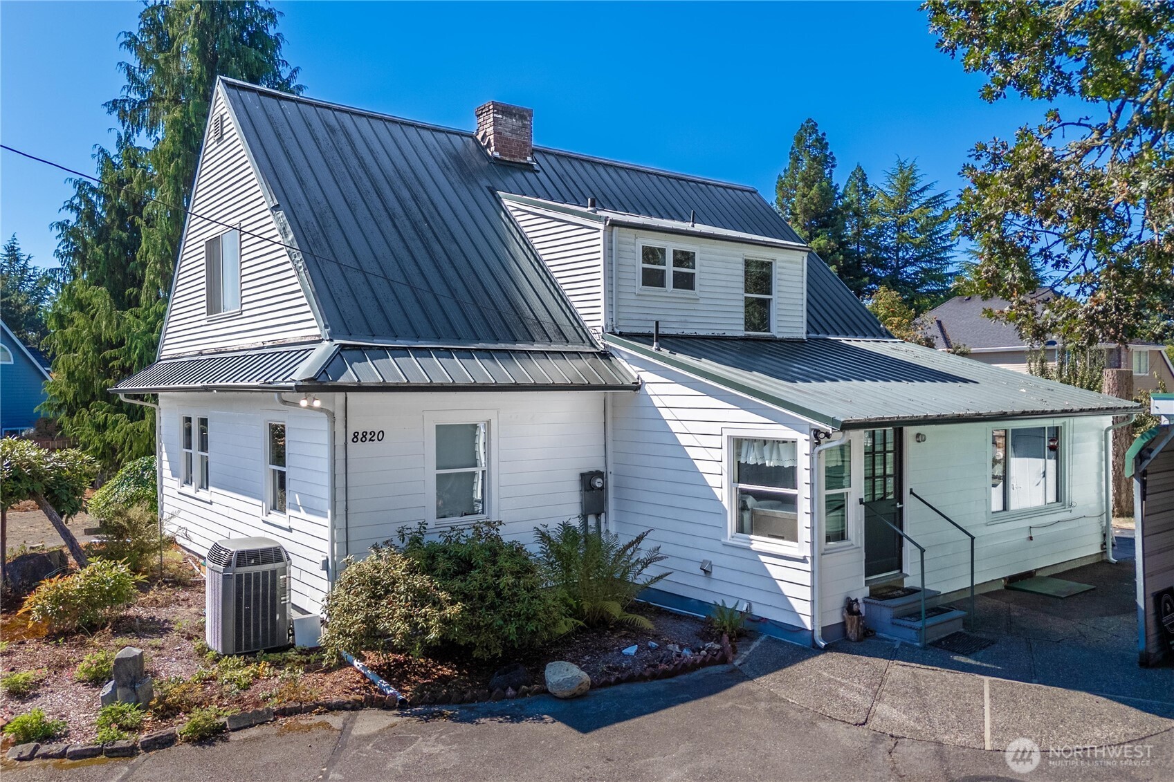a front view of a house with garden