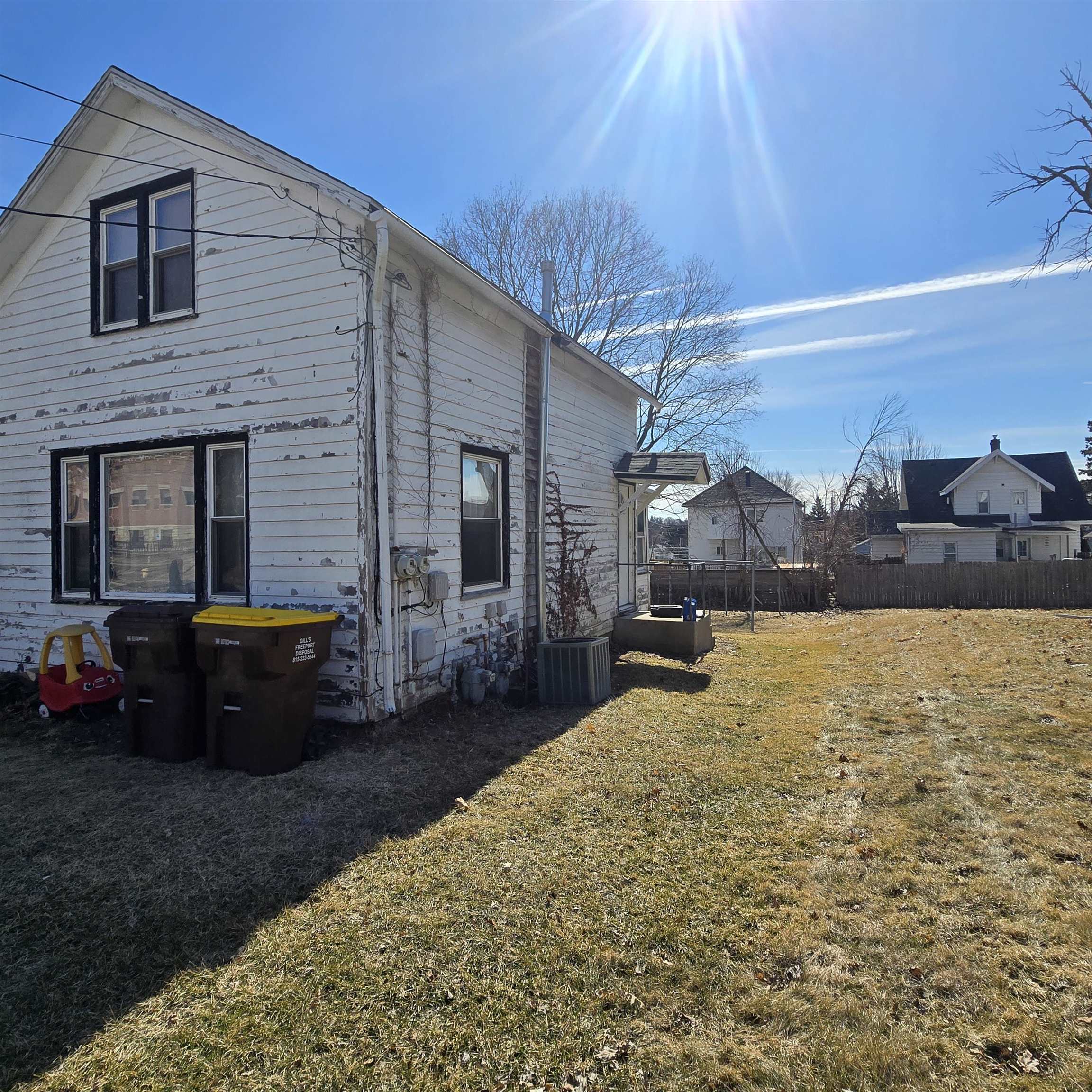 807-809 West Pleasant Street Freeport, IL 61032 - Photo 2 of 3 a view of a house with backyard and sitting area