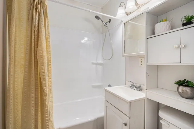 a bathroom with a sink and a bathtub