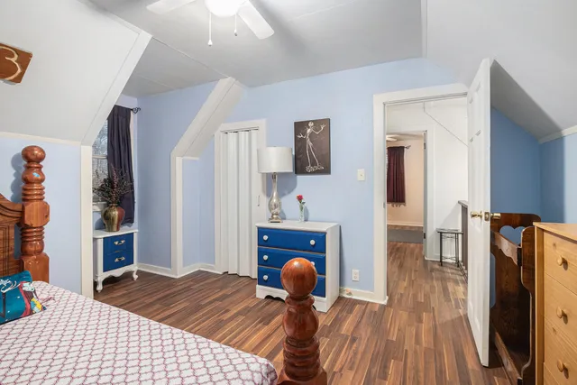 a bedroom with furniture and a fireplace