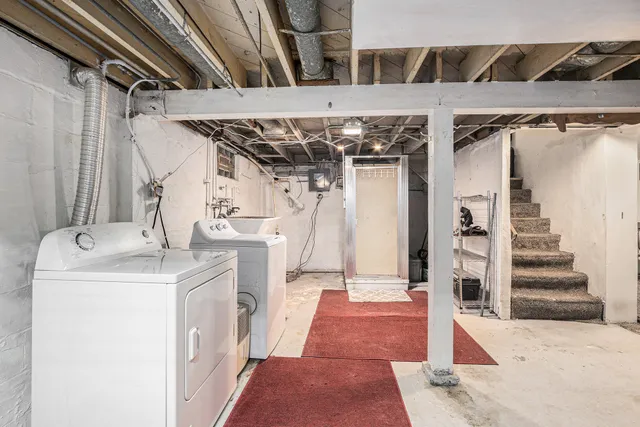 a view of a storage & utility room with stairs