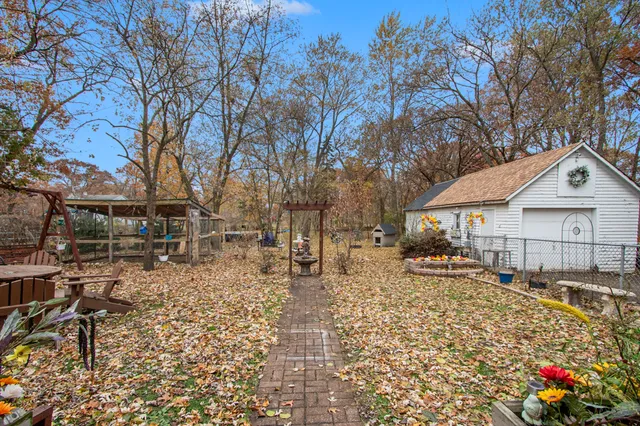 a view of a house with wooden fence